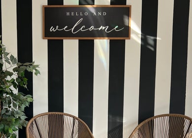 Welcome sign at Bella Tu Beauty Styling with striped wall, Pretoria, Gauteng, ZA.