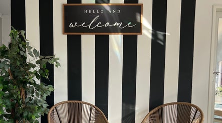 Welcome sign at Bella Tu Beauty Styling with striped wall, Pretoria, Gauteng, ZA.