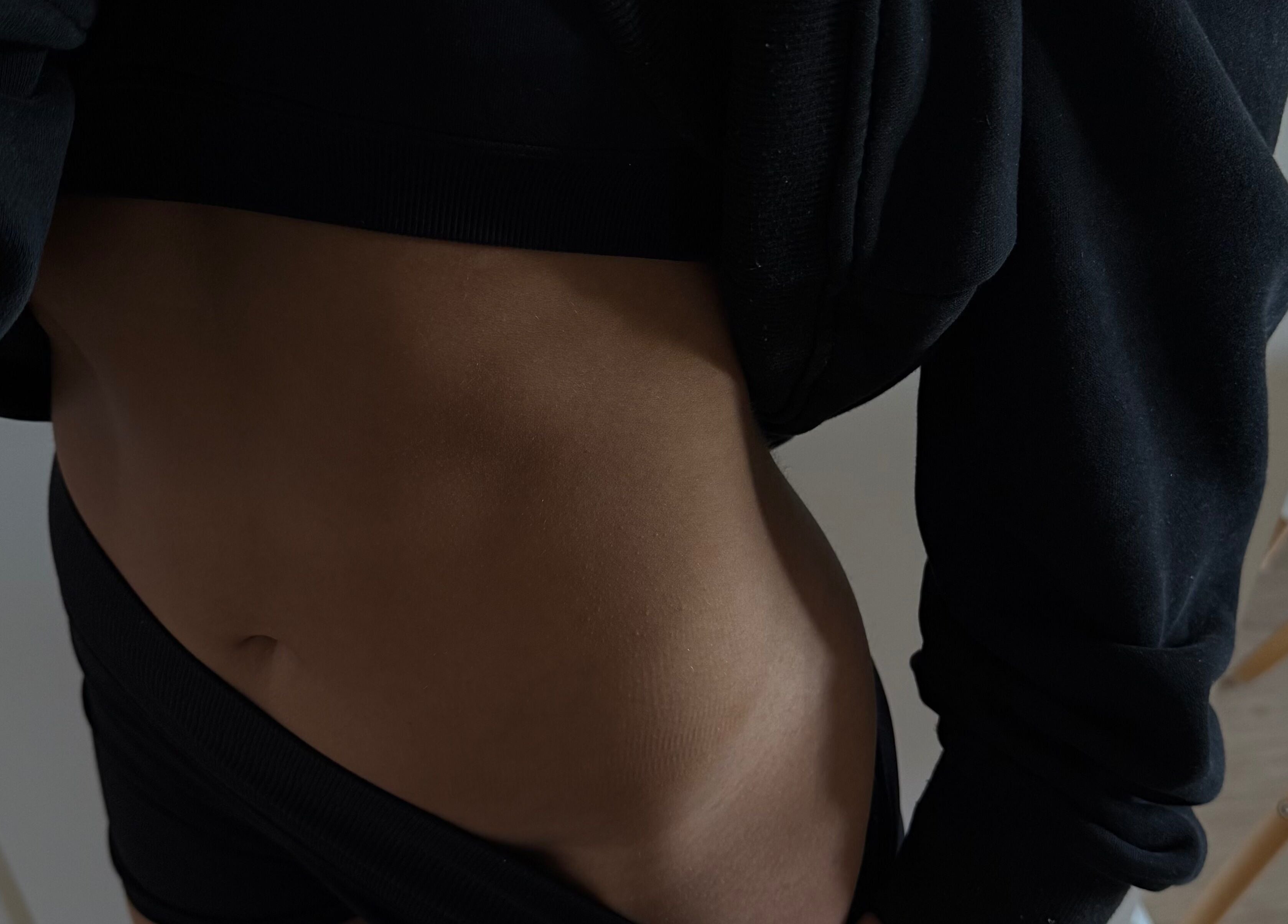 Tanned midsection at Makeme.TAN, Lightsview, South Australia, AU, showcasing a smooth, bronzed skin tone.