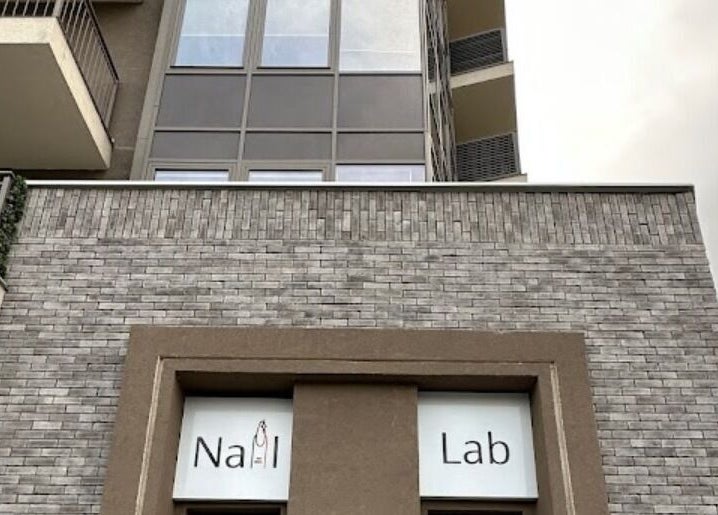 Exterior view of Nail Lab IR Belgrade Waterfront, Beograd, RS with a modern brick design.