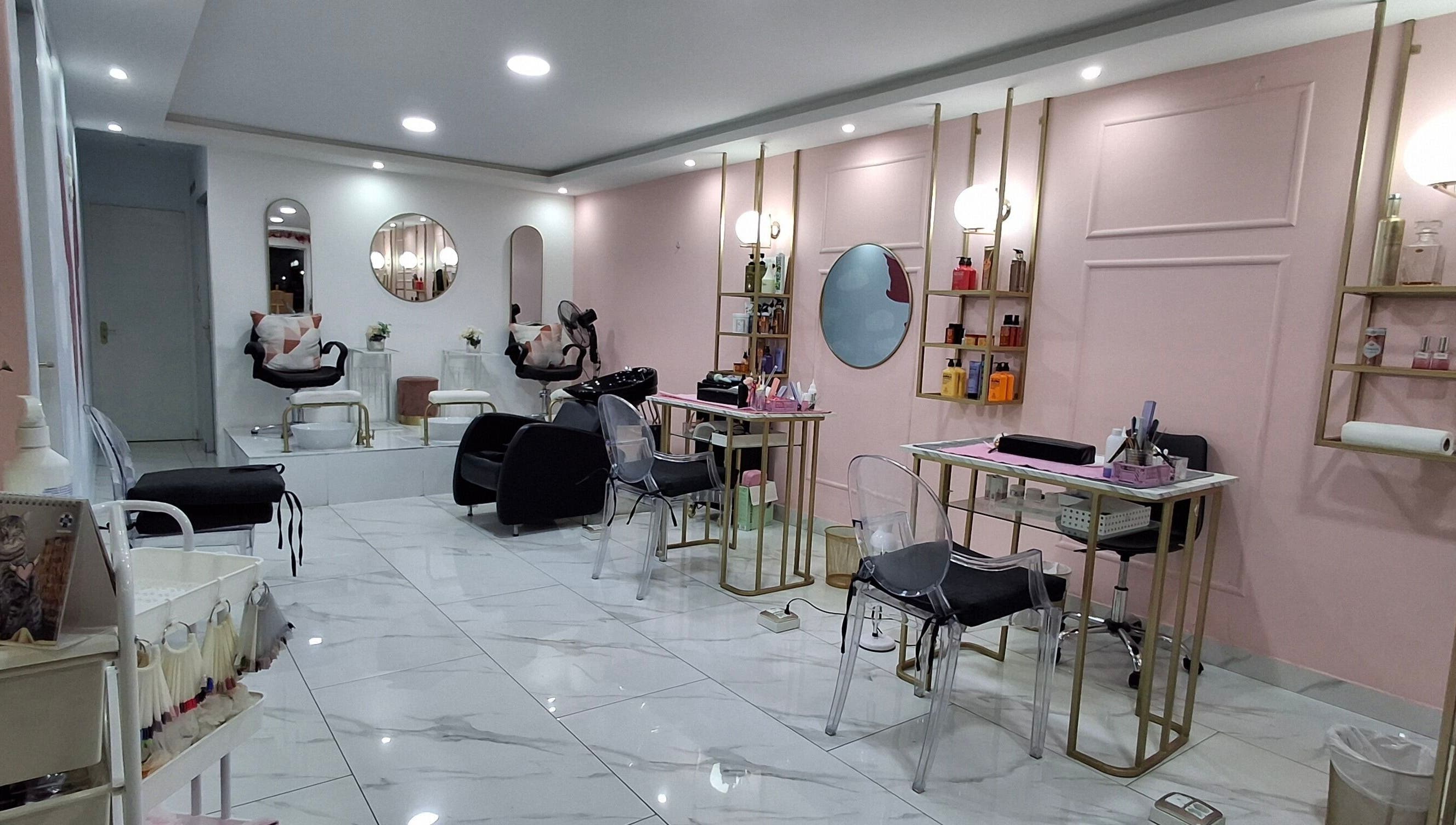 Interior view of XO' Beauty by Micaela in Johannesburg, Gauteng, ZA featuring chic salon chairs and soft pink walls.