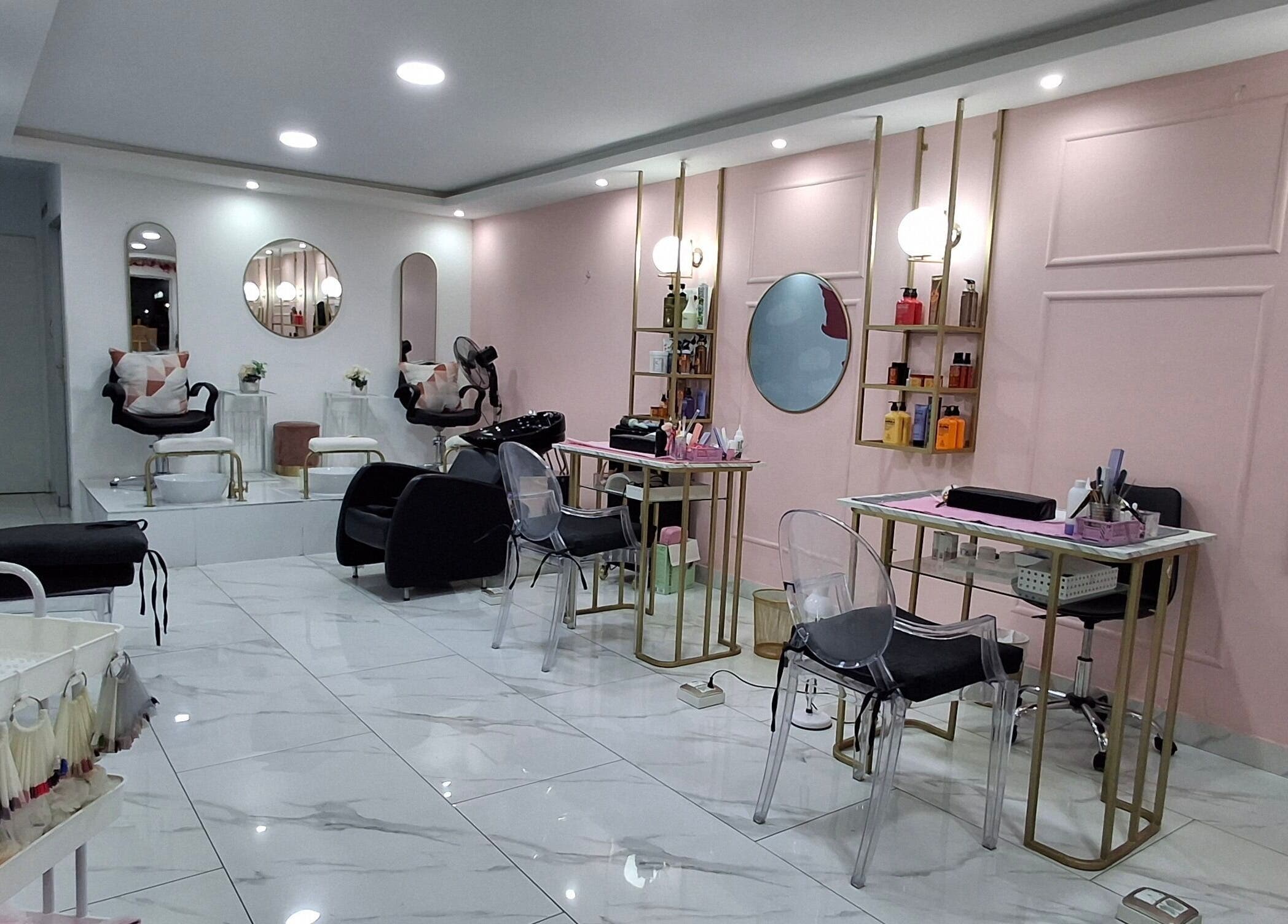 Interior view of XO' Beauty by Micaela in Johannesburg, Gauteng, ZA featuring chic salon chairs and soft pink walls.