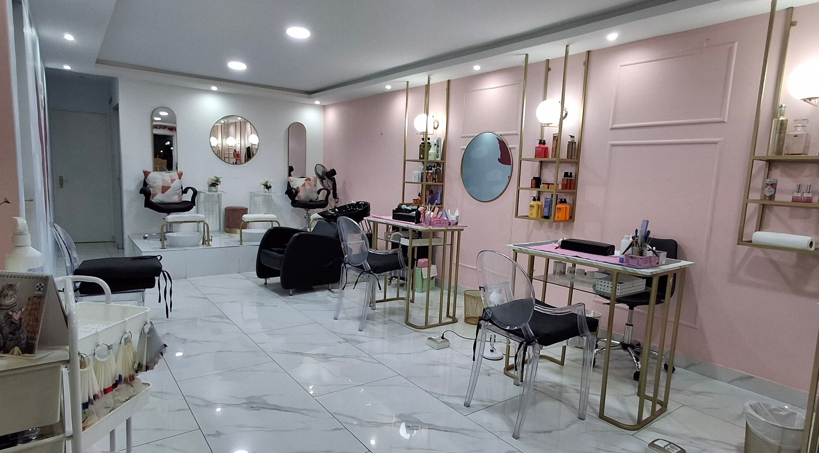 Interior view of XO' Beauty by Micaela in Johannesburg, Gauteng, ZA featuring chic salon chairs and soft pink walls.