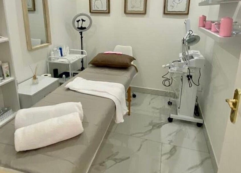Elegant spa treatment room at XO' Beauty by Micaela in Johannesburg, Gauteng, ZA, featuring a comfortable bed.