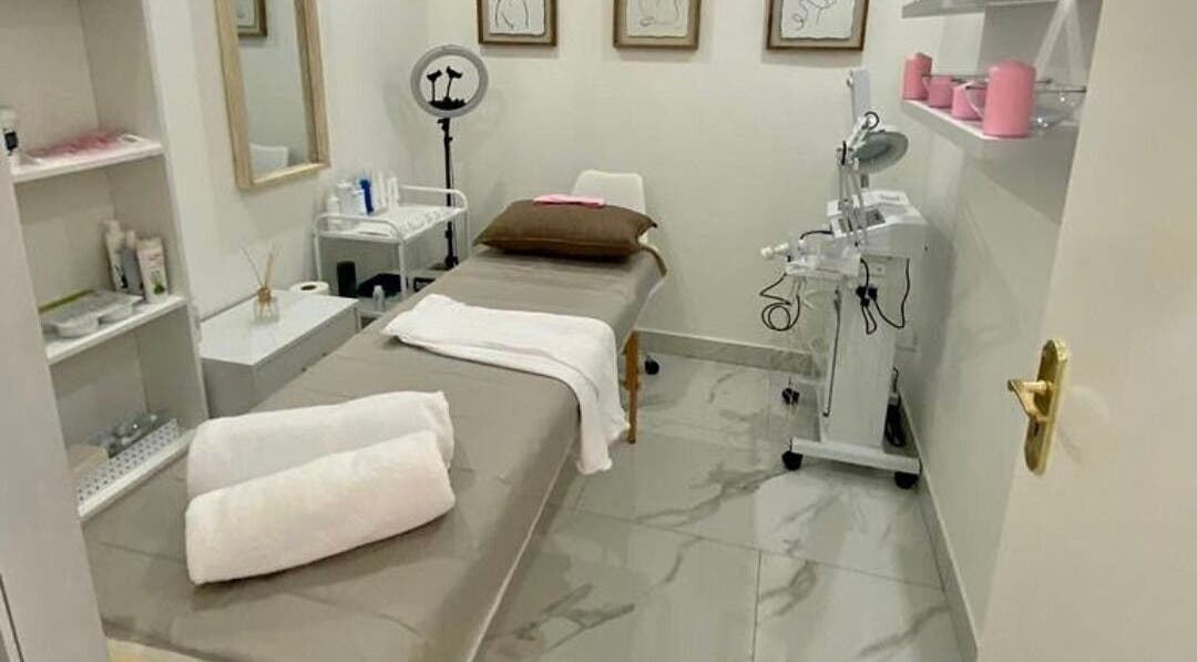 Elegant spa treatment room at XO' Beauty by Micaela in Johannesburg, Gauteng, ZA, featuring a comfortable bed.