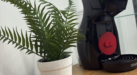 Potted fern beside coffee machine in Fade Co., County Wicklow, County Wicklow, IE. Stylish interior decor.