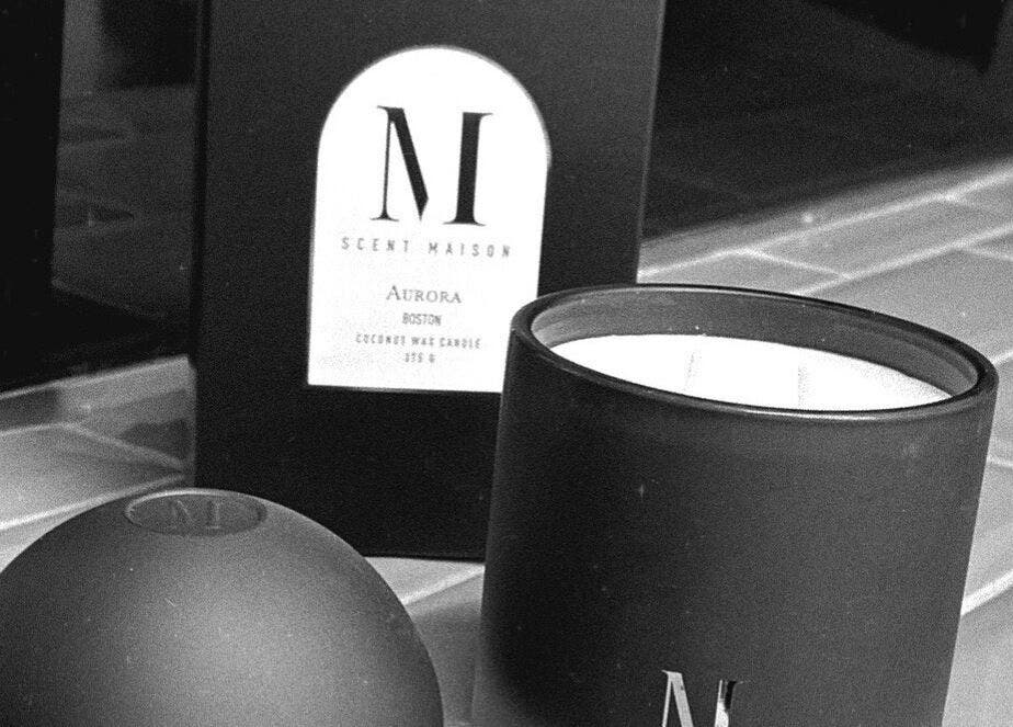Luxurious scented candle at Fade Co., County Wicklow, County Wicklow, IE, enhances wellness ambiance.