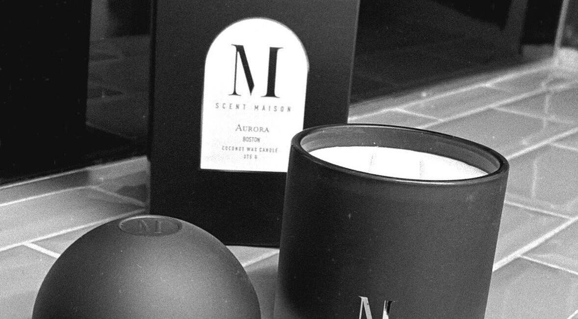 Luxurious scented candle at Fade Co., County Wicklow, County Wicklow, IE, enhances wellness ambiance.