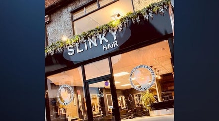 Front view of Abby Randall Hairdressing @ SLiNKY in Swindon, England, GB, showcasing stylish salon entrance.