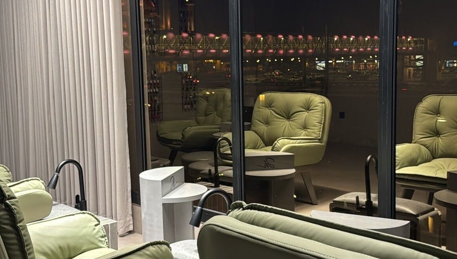 Relaxing seating area at Double H Salon & Spa, Hail, Hail Province, SA, with city views at night.