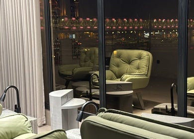 Relaxing seating area at Double H Salon & Spa, Hail, Hail Province, SA, with city views at night.