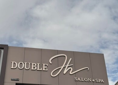 Double H Salon & Spa entrance in Hail, Hail Province, SA under a clear, inviting sky.