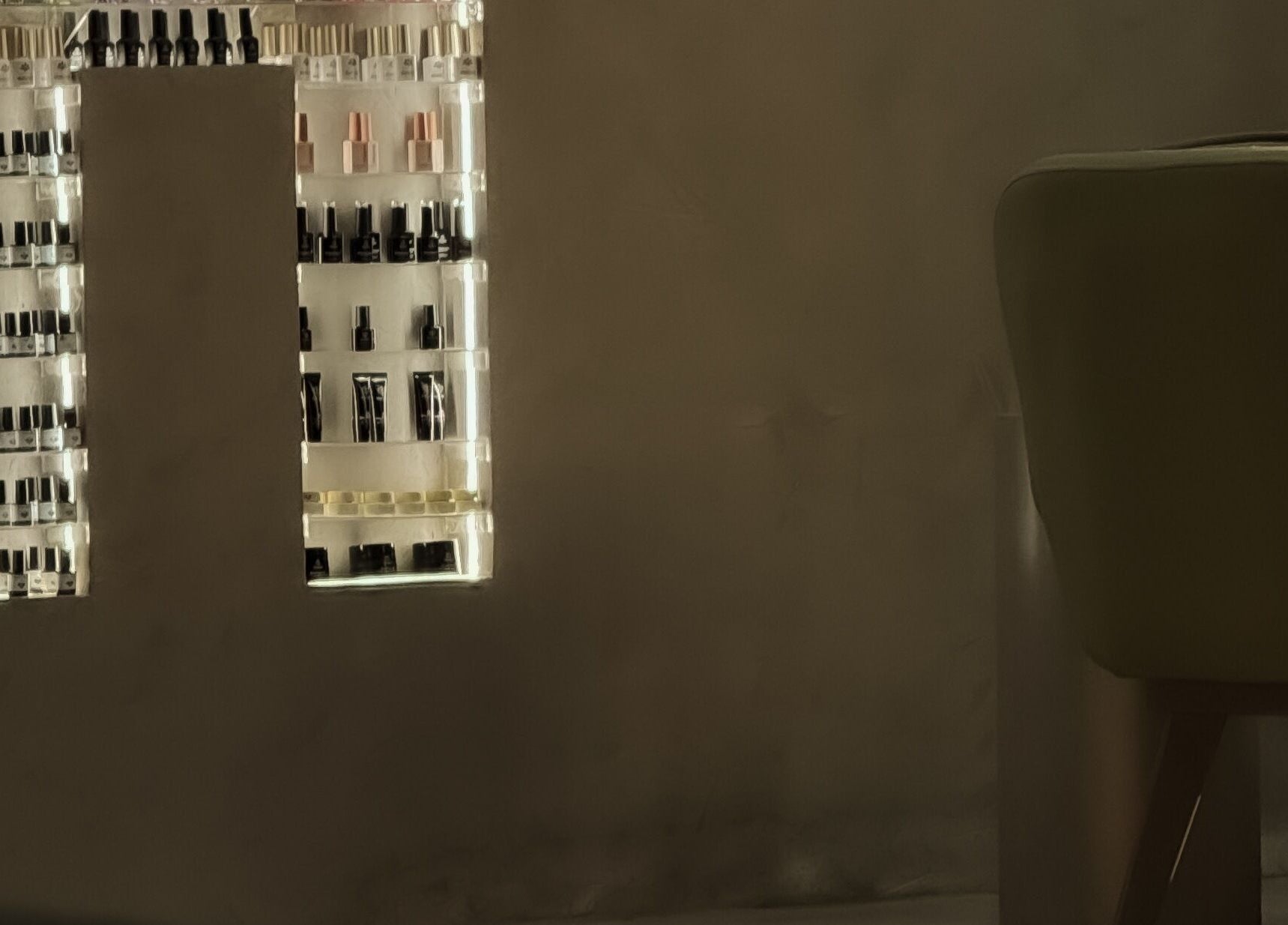 Elegant nail polish display at Double H Salon & Spa, Hail, Hail Province, SA, showcasing a variety of colors.