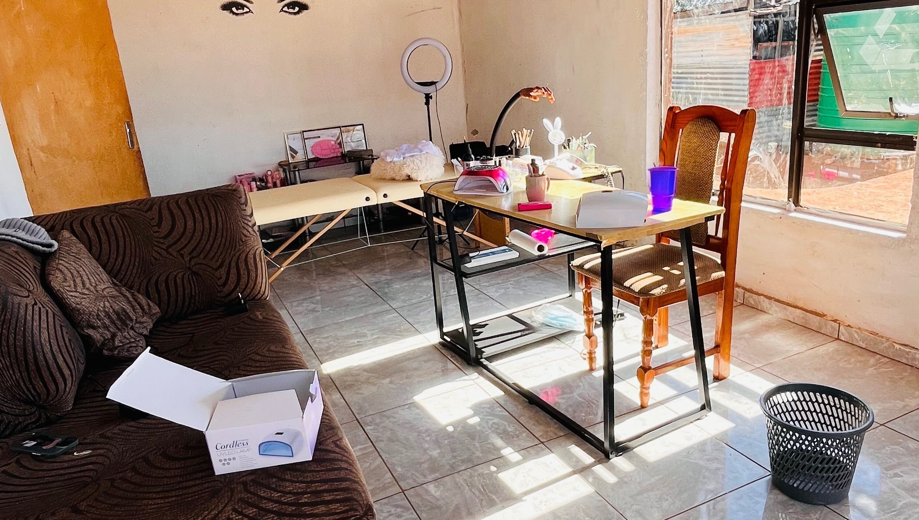 Warm, inviting interior of Cosmic Nails' beauty station in Kuruman, Northern Cape, ZA showcasing cozy workspace.