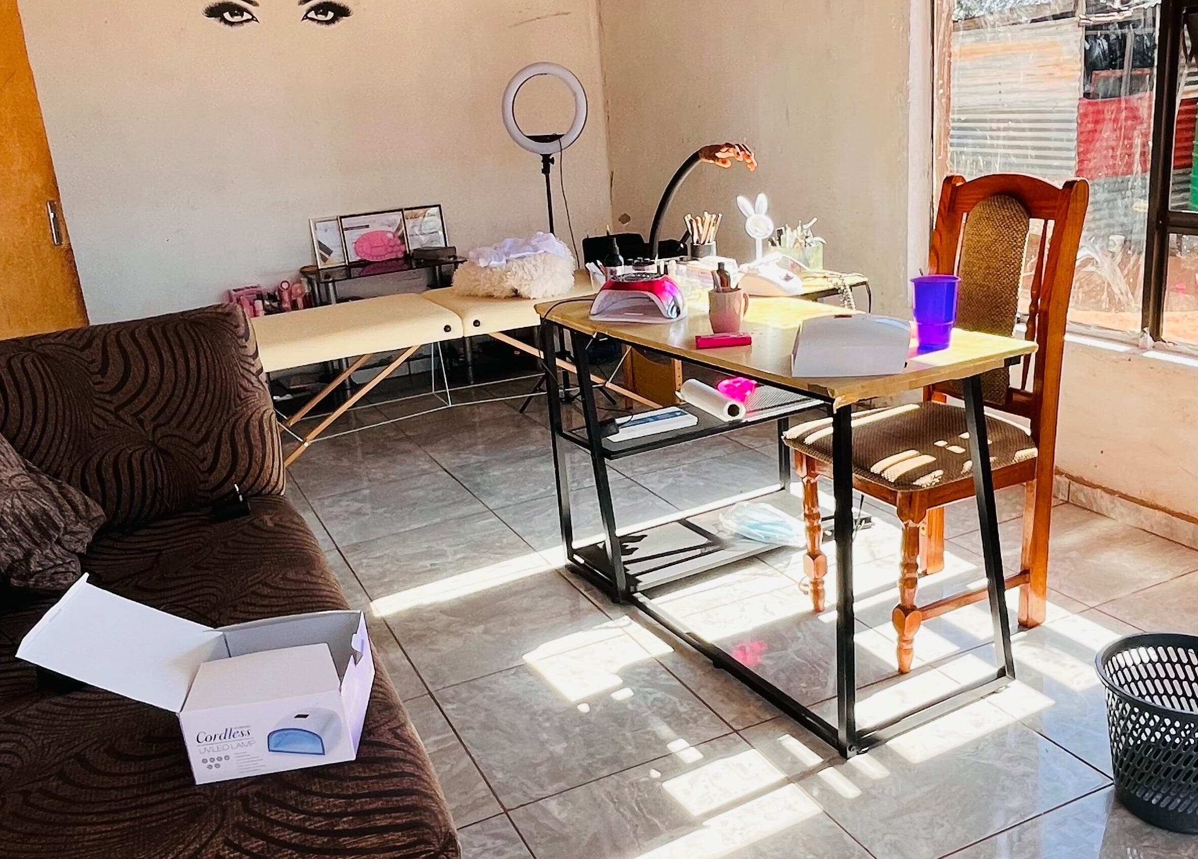 Warm, inviting interior of Cosmic Nails' beauty station in Kuruman, Northern Cape, ZA showcasing cozy workspace.