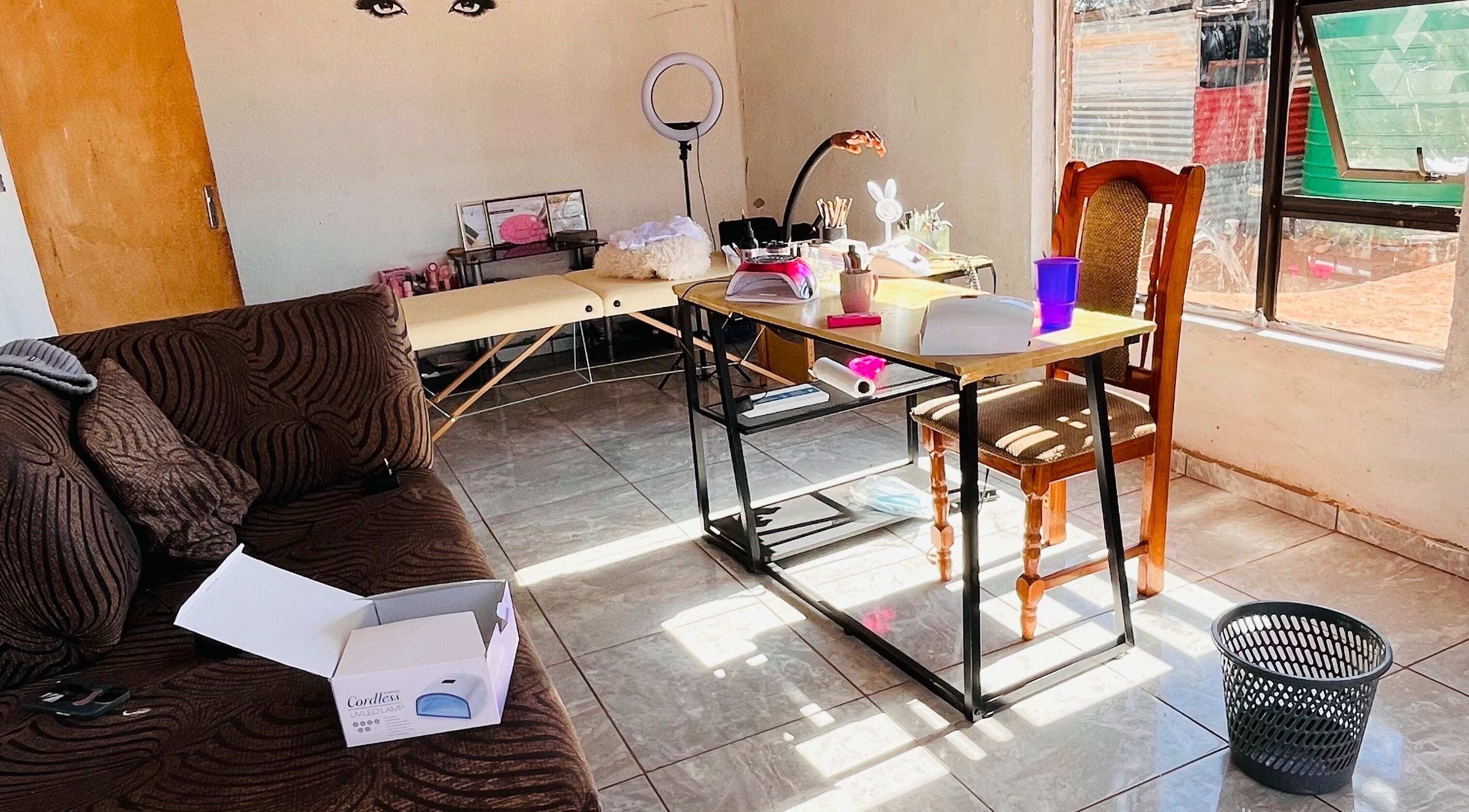 Warm, inviting interior of Cosmic Nails' beauty station in Kuruman, Northern Cape, ZA showcasing cozy workspace.