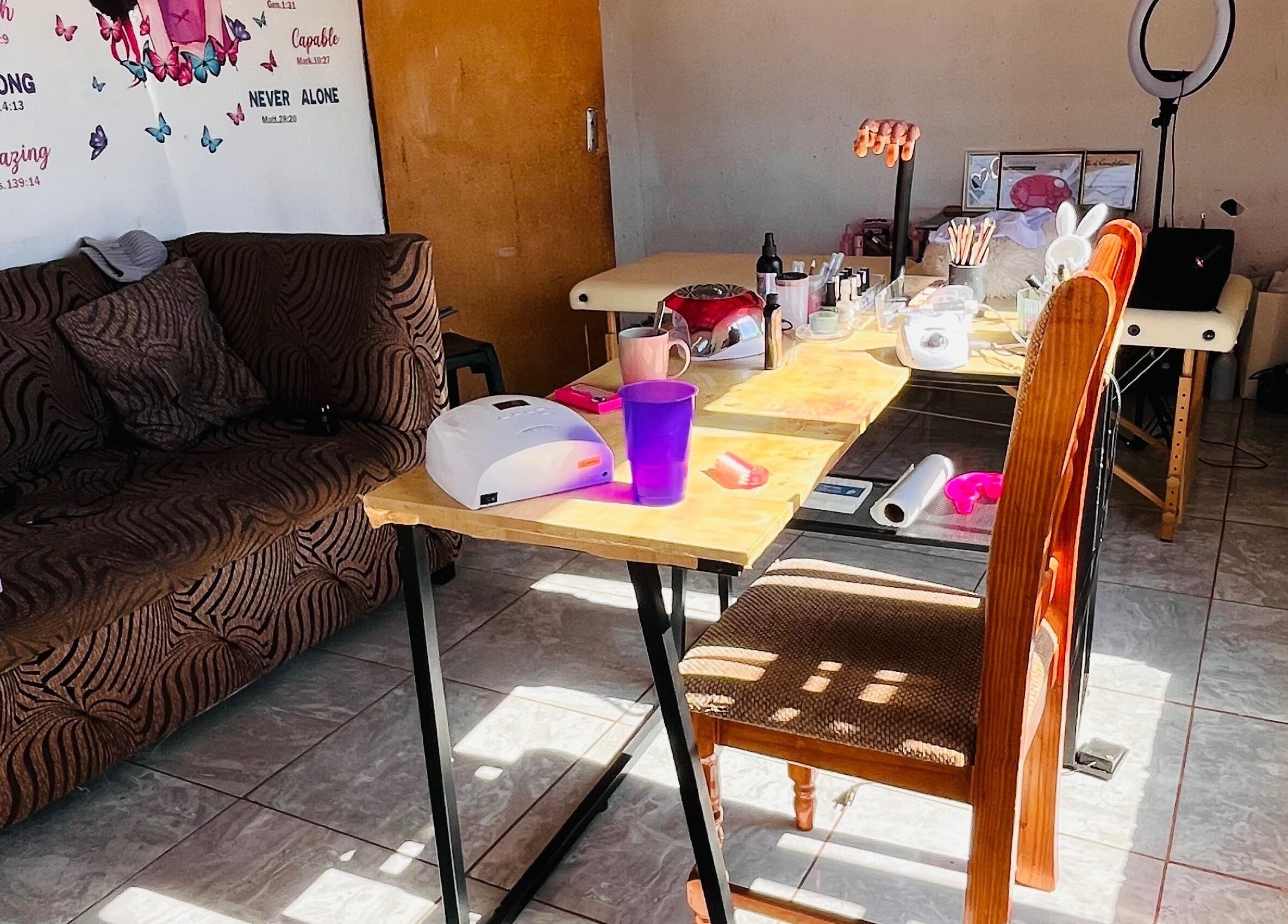 Bright and inviting nail station at Cosmic Nails, Kuruman, Northern Cape, ZA, showcasing a cozy work area.