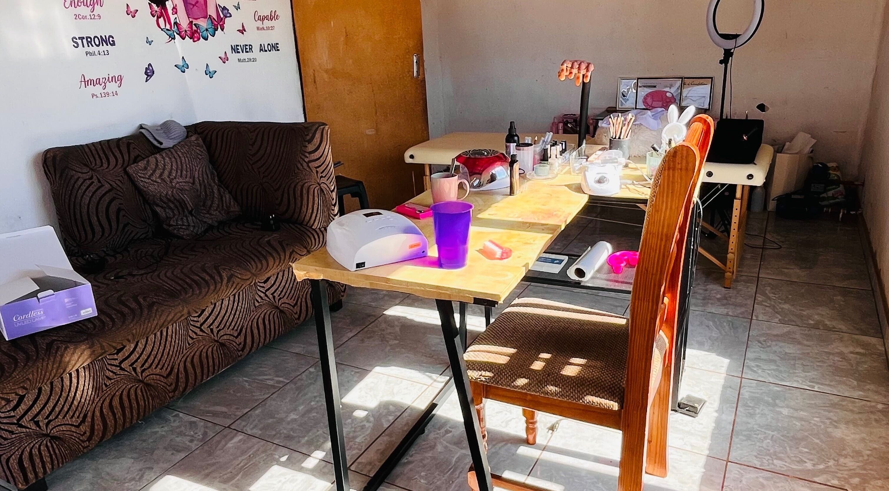 Bright and inviting nail station at Cosmic Nails, Kuruman, Northern Cape, ZA, showcasing a cozy work area.