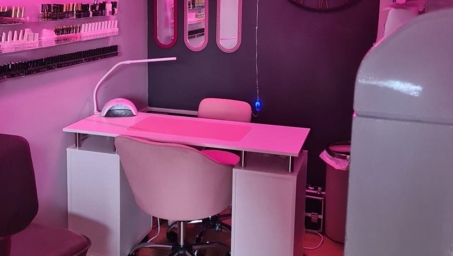 Nail station at Nikki Nailed it @ Tease 2 with pink lighting, Hazel Grove, England, GB.