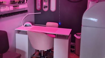 Nail station at Nikki Nailed it @ Tease 2 with pink lighting, Hazel Grove, England, GB.
