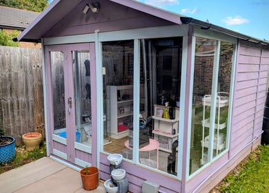 Charming garden studio at Nikki Nailed It in Hazel Grove, England, GB, surrounded by colorful pots.