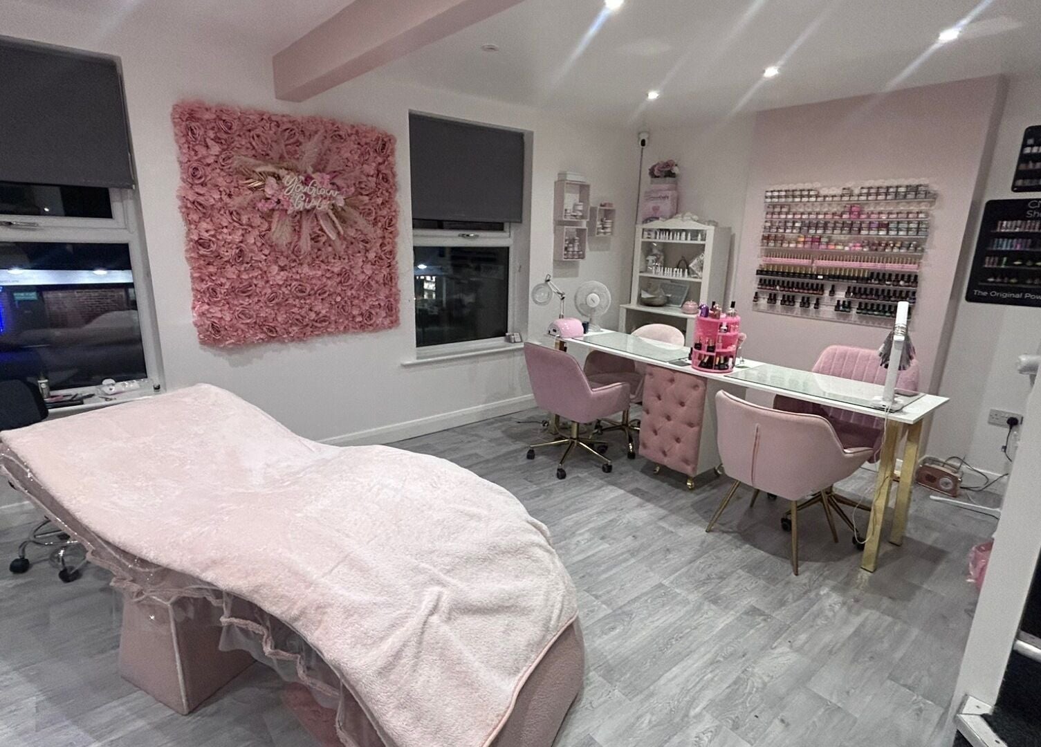 Chic interior of B’Glammed By Us in Leyland, England, featuring blush decor and styling stations.