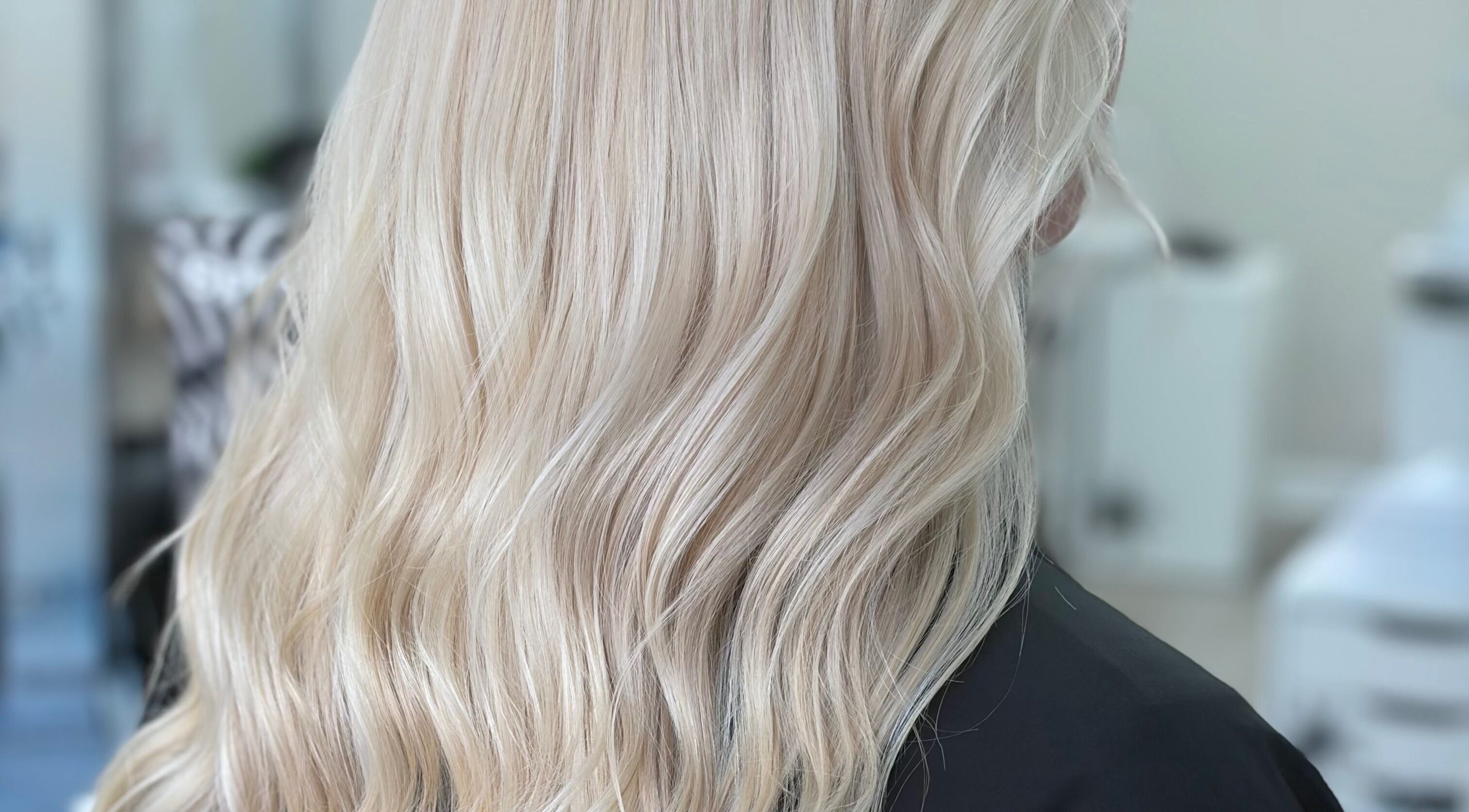 Elegant blonde waves styled at Hair by Georgia Nicole in Sandbach, England, GB salon.