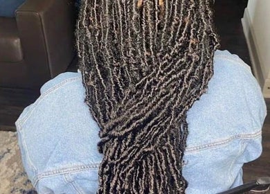 Intricate braid hairstyle at Hair & Skin By Amber in Conyers, Georgia, US, showcasing detailed craftsmanship.