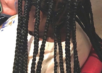 Intricate braids styled at Hair & Skin By Amber, Conyers, Georgia, US, showcasing expert hair techniques.