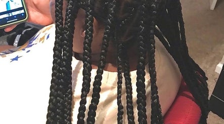 Intricate braids styled at Hair & Skin By Amber, Conyers, Georgia, US, showcasing expert hair techniques.