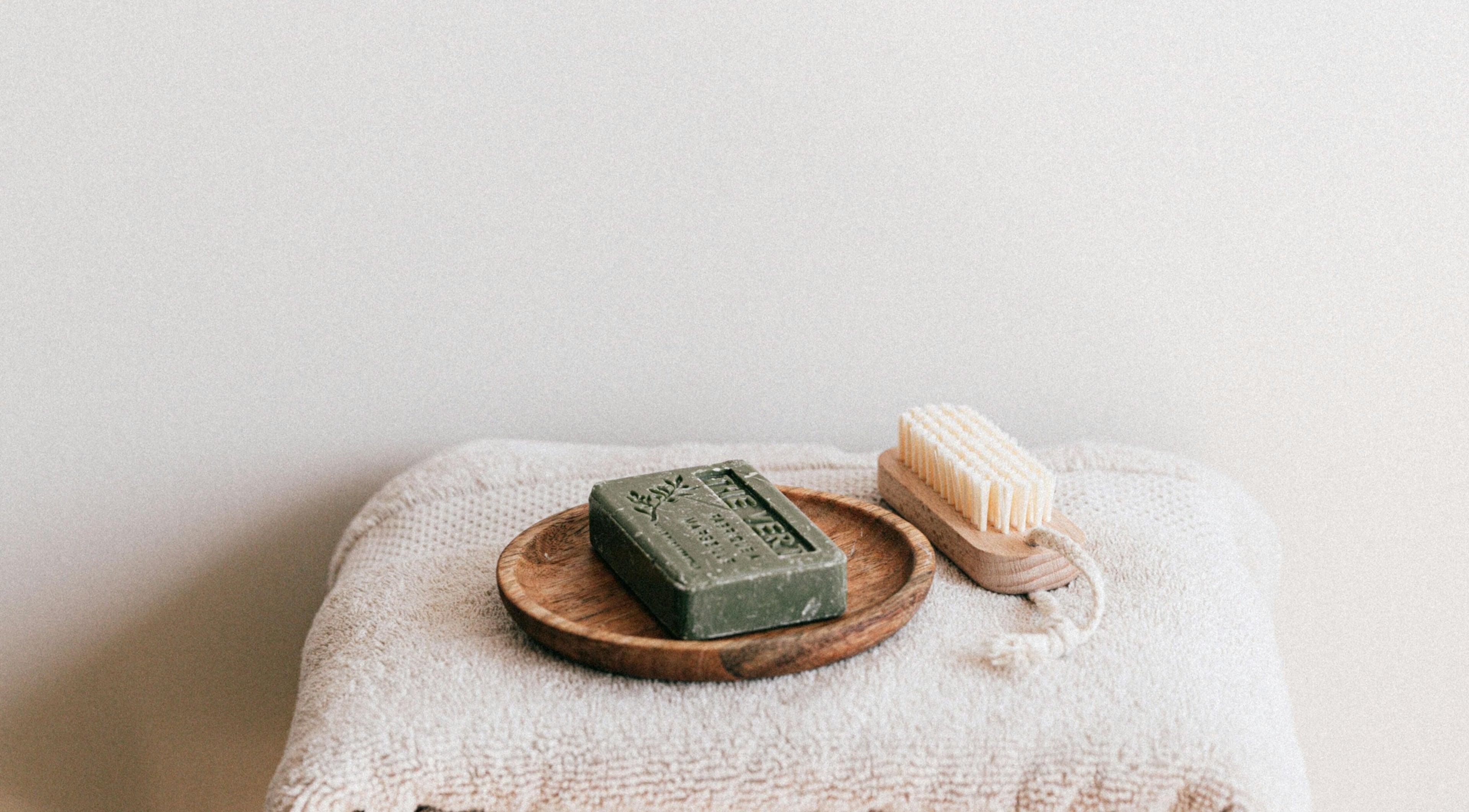 Natural soap and brush on towels at MassageFit, Centurion, Gauteng, ZA.