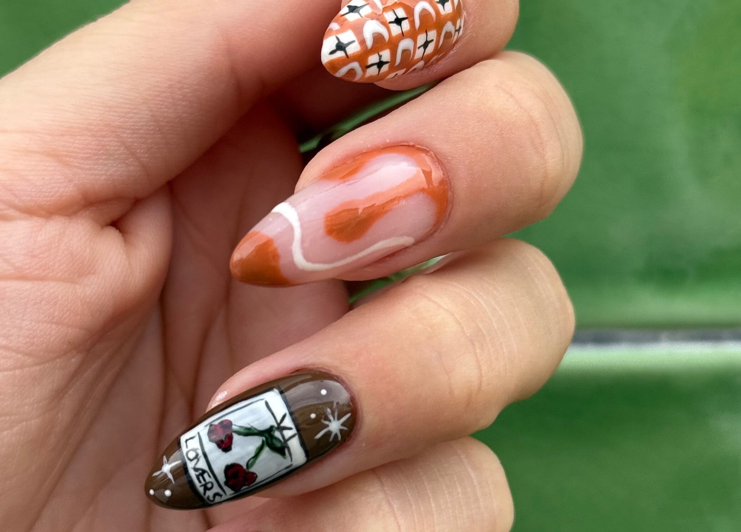 Intricate nail art design at Popsie Nails, Newquay, England, GB showcases unique patterns and colors.