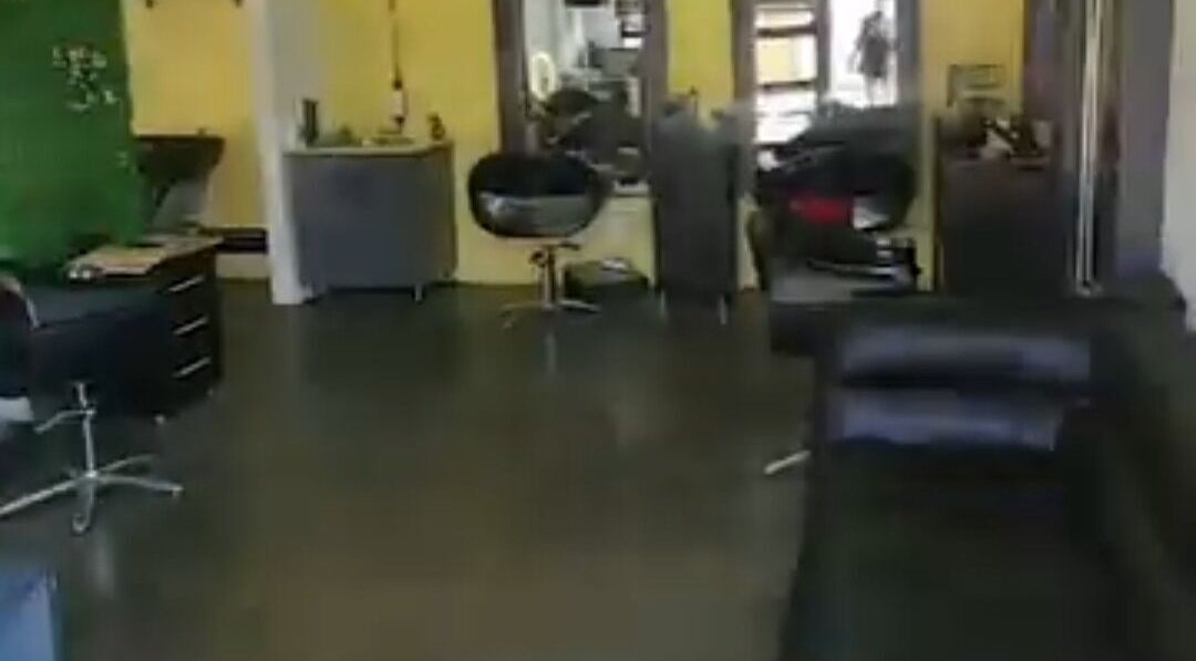 Modern salon interior at K BROWNS HAIR, Pretoria, Gauteng, ZA. Features sleek chairs and stylish decor.