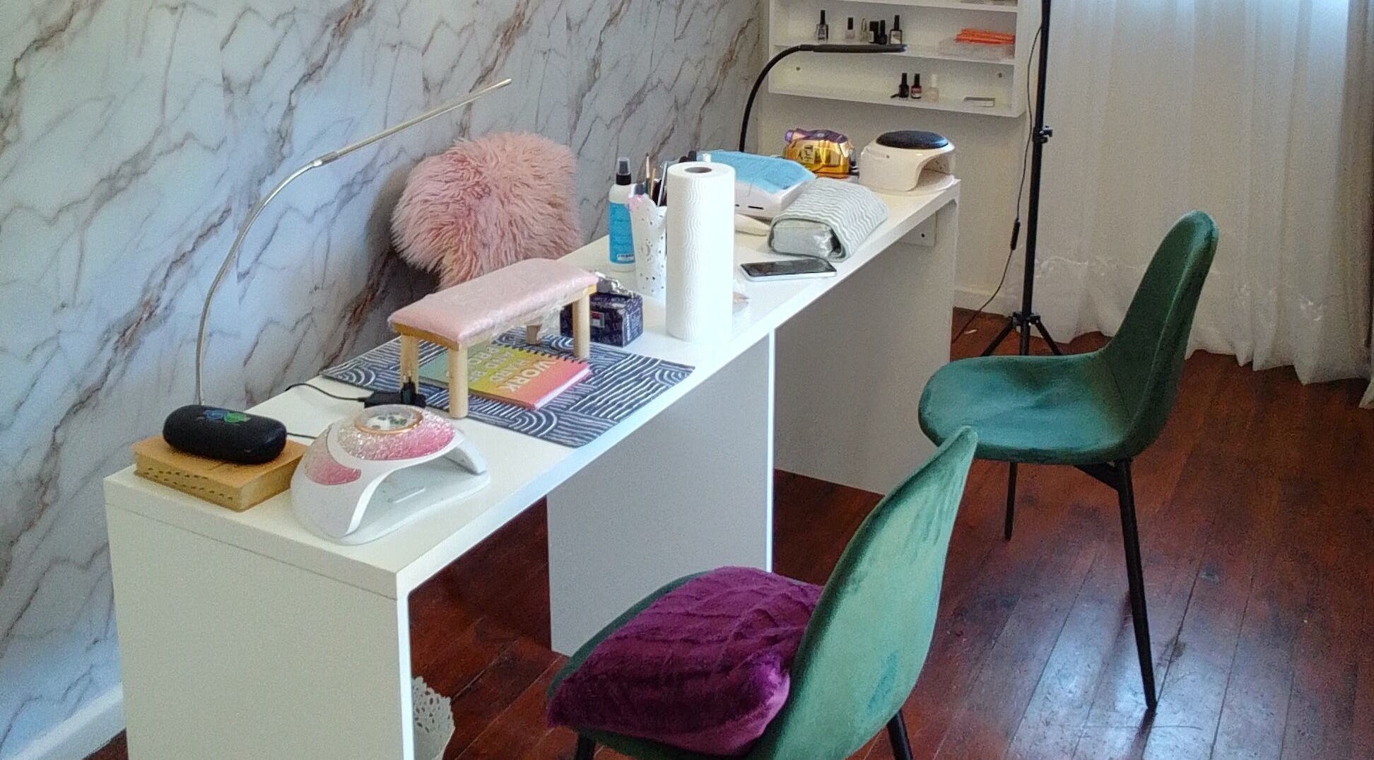 Nail station at The Nail Statement & Beauty Spa, Gqeberha, Eastern Cape, ZA. Elegant setup with chairs and tools.