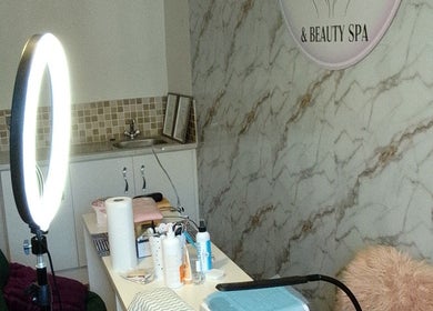 The Nail Statement & Beauty Spa, Gqeberha, Eastern Cape, ZA. Cozy nail treatment room with marble decor.