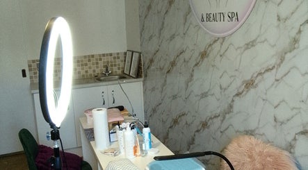 The Nail Statement & Beauty Spa, Gqeberha, Eastern Cape, ZA. Cozy nail treatment room with marble decor.