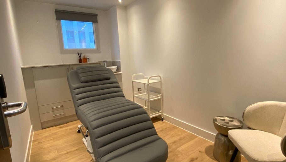 Modern treatment room with a plush chair at Brow Studio London, London, England, GB.