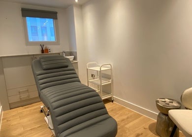 Modern treatment room with a plush chair at Brow Studio London, London, England, GB.