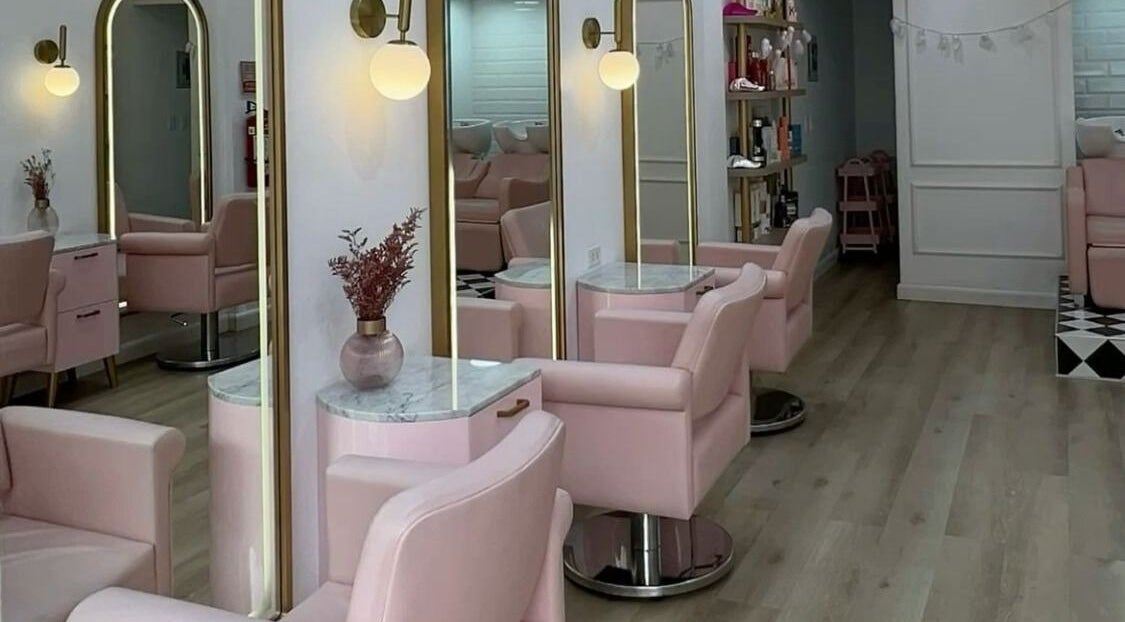 Chic interior of Beauty Crown Ladies Saloon, Sharjah, Sharjah, AE featuring modern pink salon chairs.