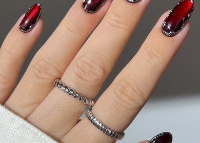 Elegant red glossy nails at Nails by Bon Washington in Washington, England, GB, showcasing premium nail art.