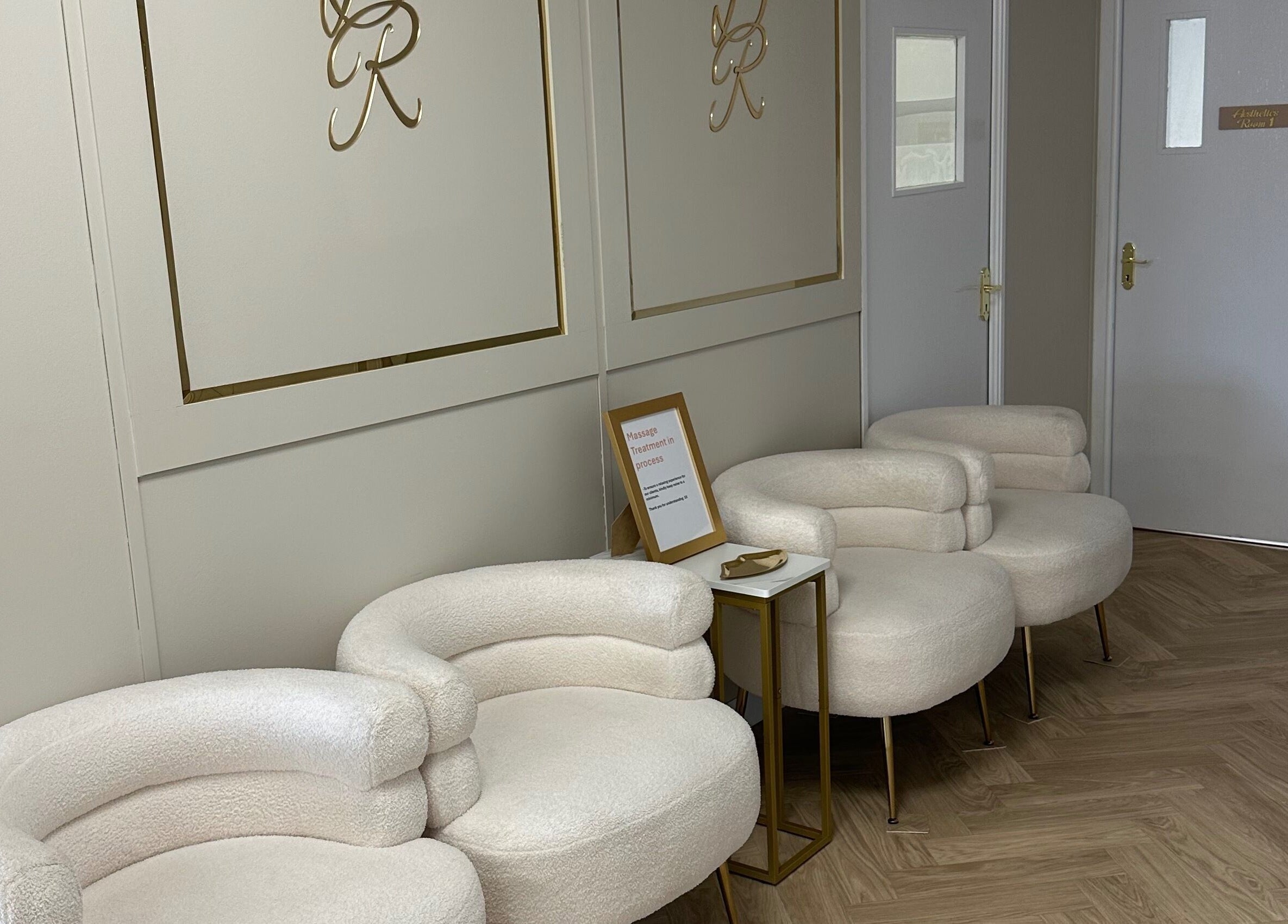 Stylish lounge area at Danielle Rose Aesthetics in Southampton, England, GB, featuring modern chairs and decor.
