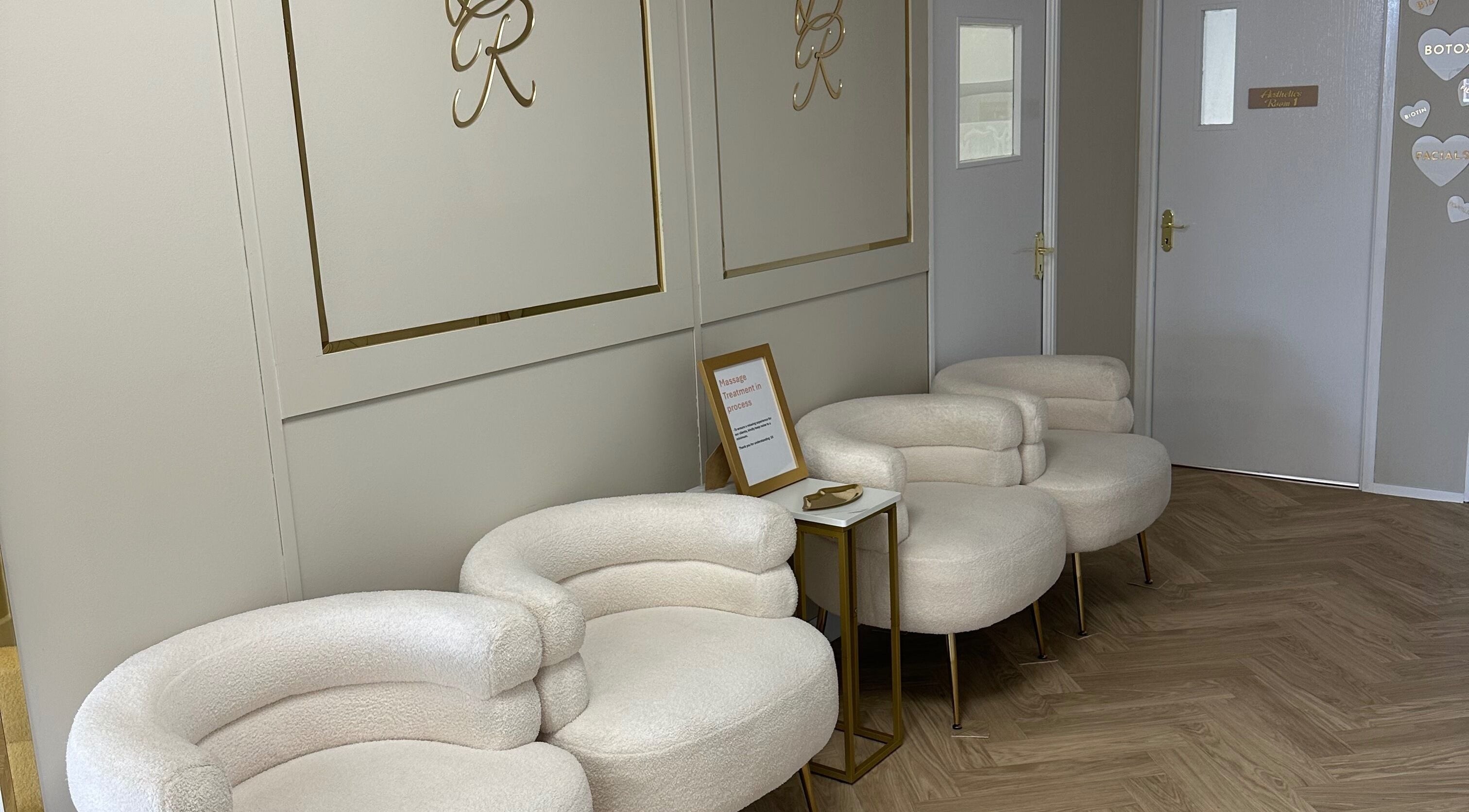 Stylish lounge area at Danielle Rose Aesthetics in Southampton, England, GB, featuring modern chairs and decor.