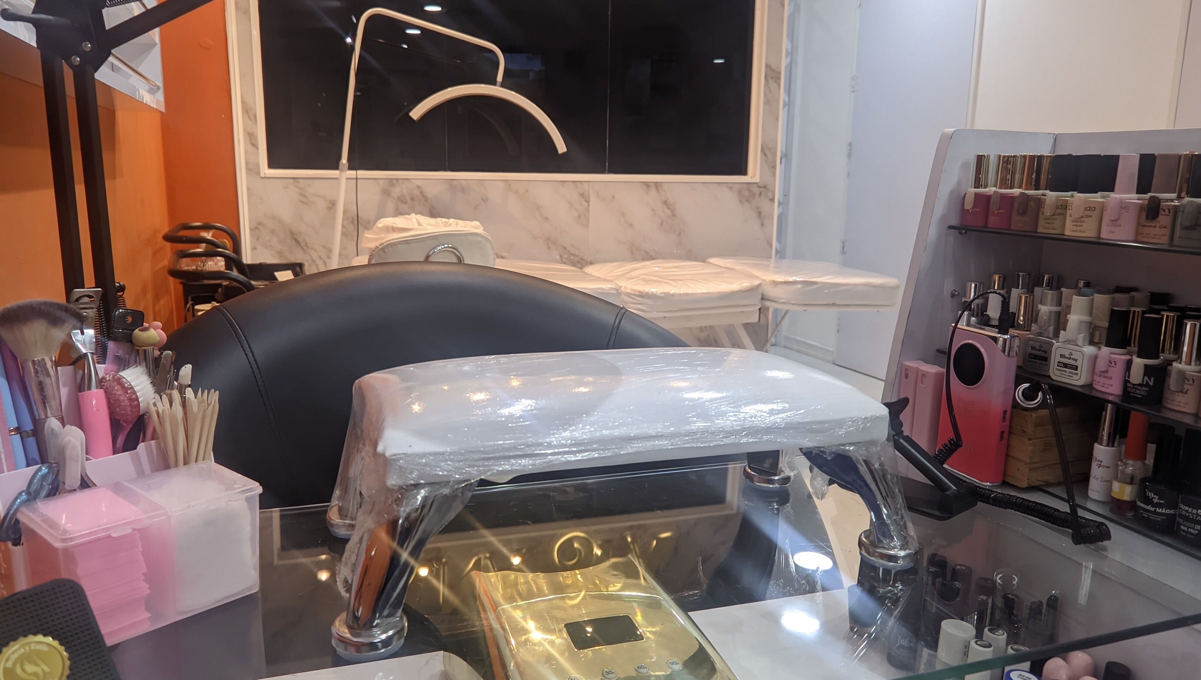 Elegant setup at Mariana Nails in Caracas, Distrito Capital, VE featuring nail polish and manicure tools.