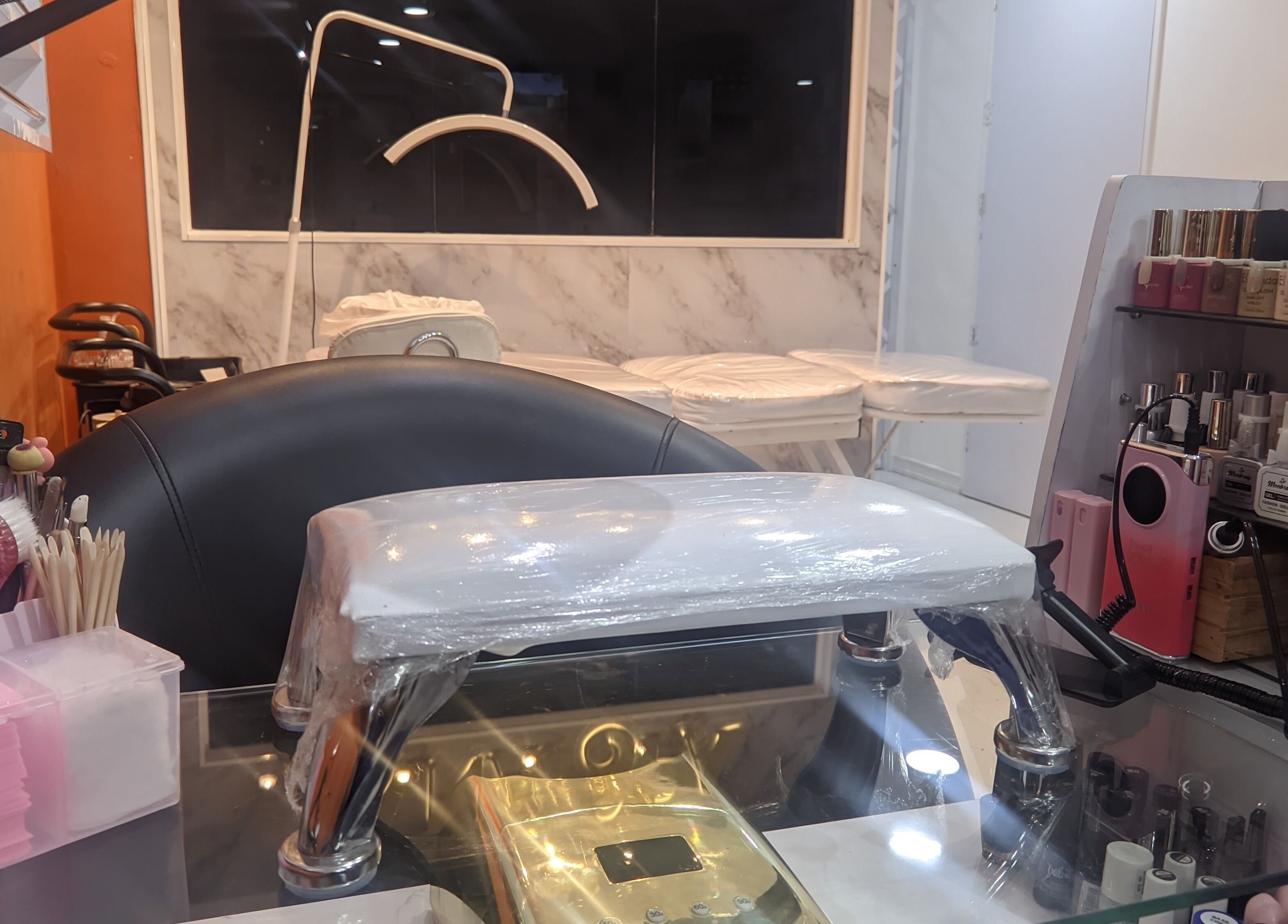 Elegant setup at Mariana Nails in Caracas, Distrito Capital, VE featuring nail polish and manicure tools.