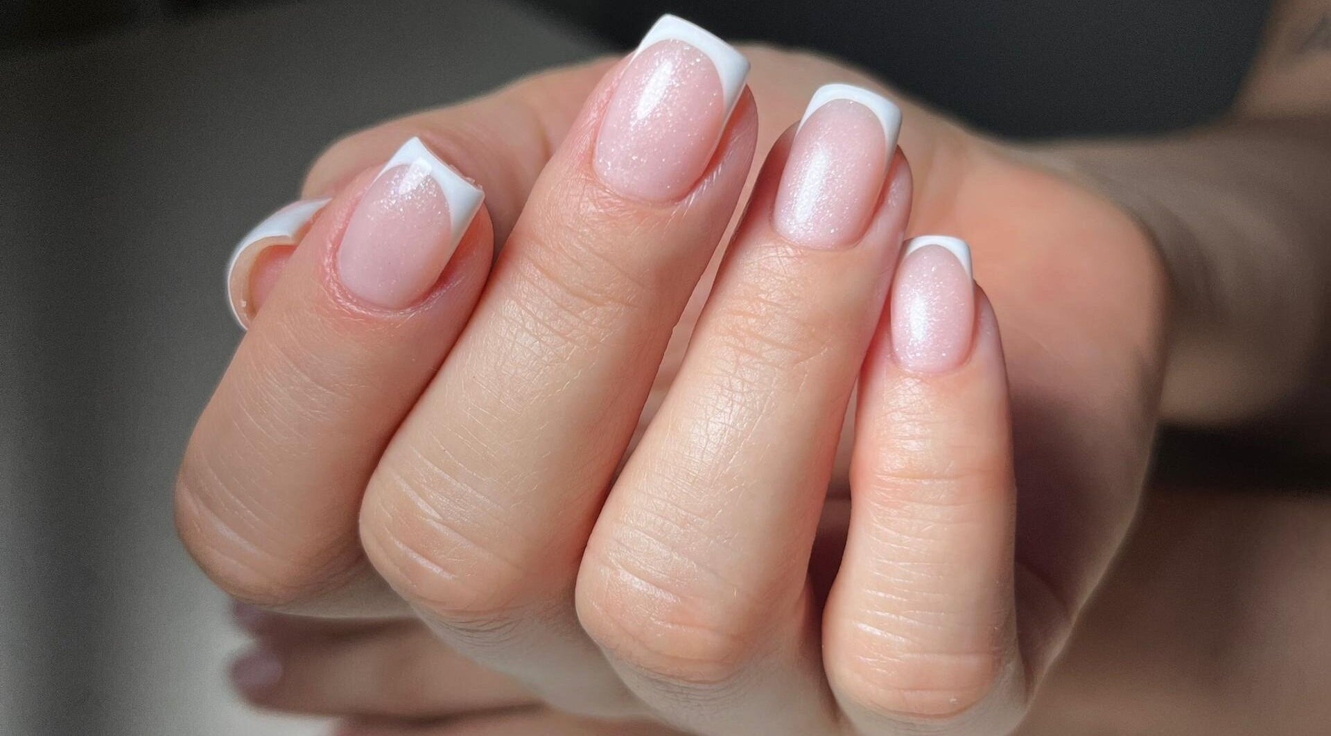 Elegant French manicure at Mariana Nails, Caracas, Distrito Capital, VE with glossy white tips.