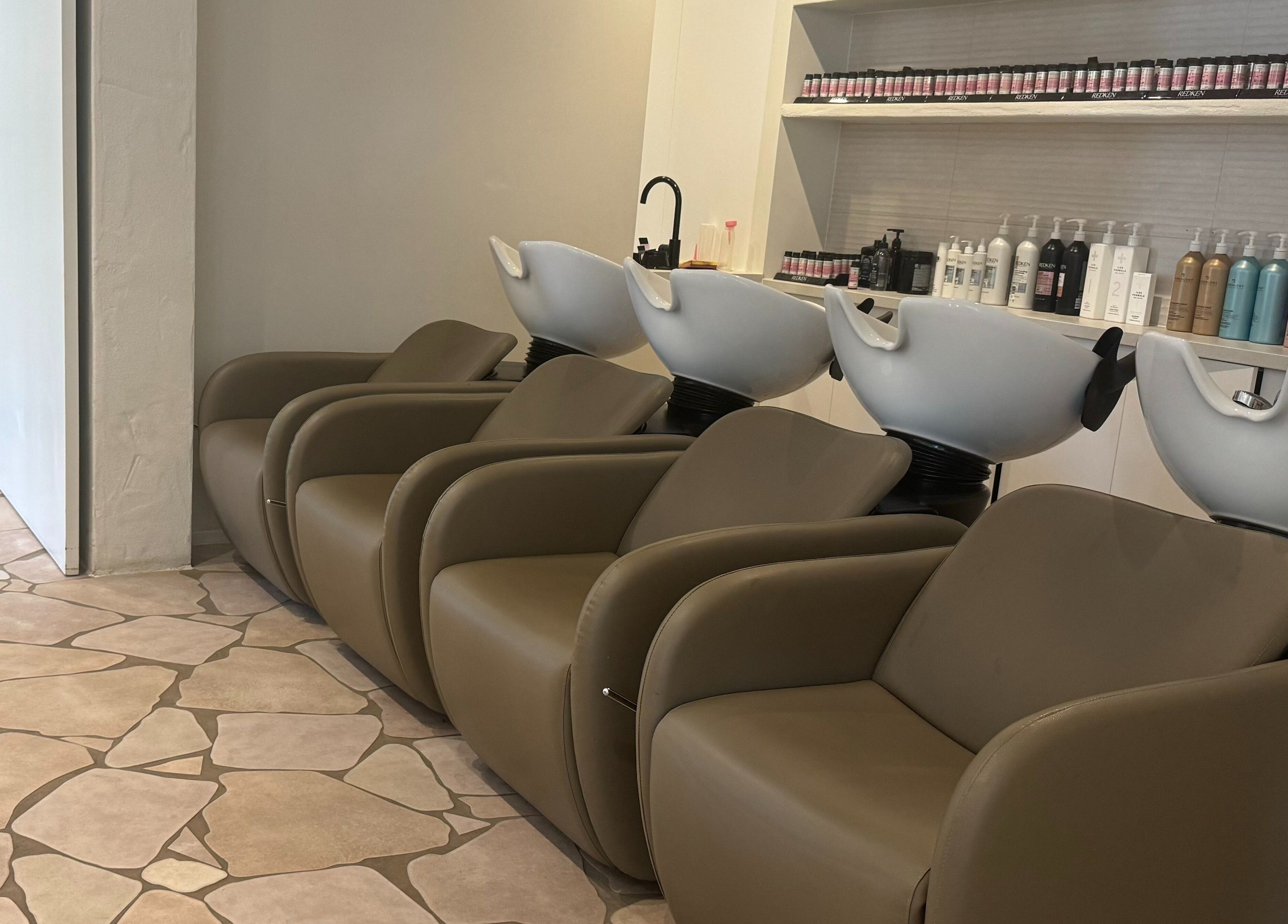 Modern hair wash stations at Farrah Studio, New Farm, Queensland, AU, featuring sleek design and comfort.