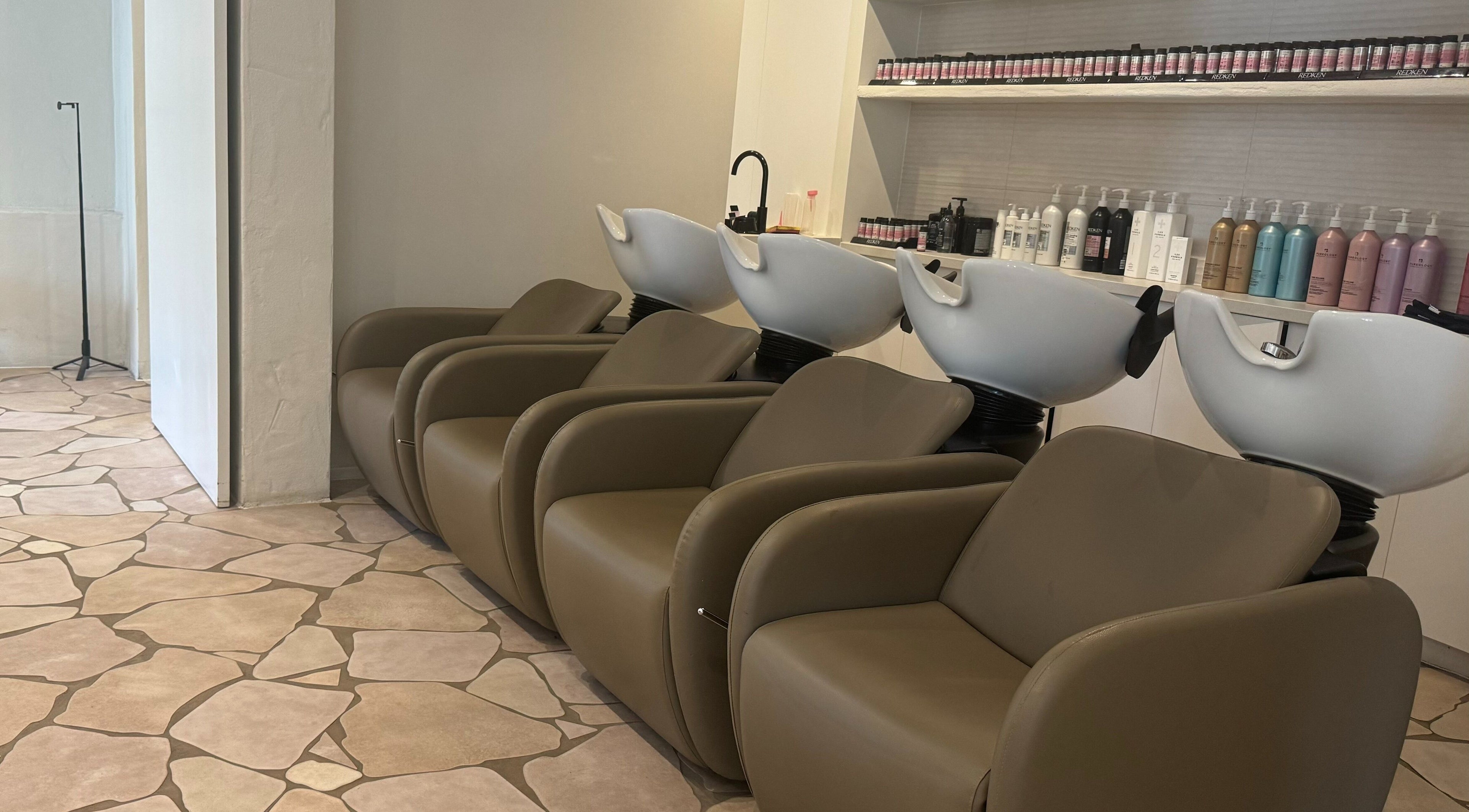 Modern hair wash stations at Farrah Studio, New Farm, Queensland, AU, featuring sleek design and comfort.