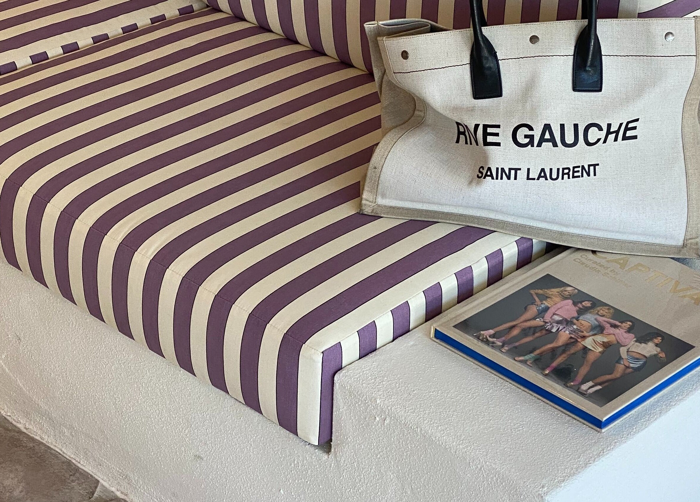 Elegant striped seating with a designer bag at Farrah Studio, New Farm, Queensland, AU.