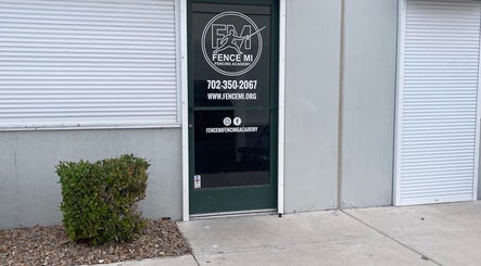 Entrance of Fence MI Fencing Academy in Las Vegas, Nevada, showcasing the academy's logo and contact details.