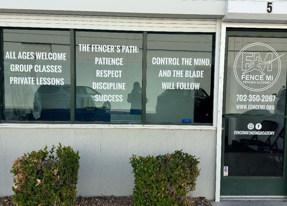 Entrance of Fence MI Fencing Academy in Las Vegas, Nevada, US with welcome and class information.